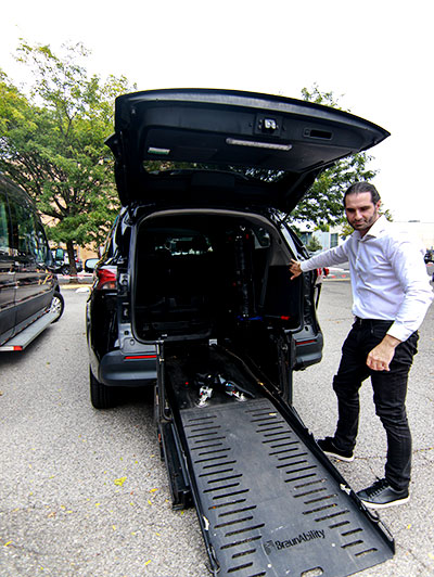 A person standing beside an ambulance