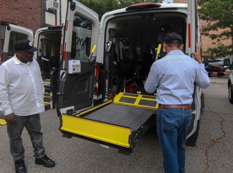 two person standing beside an ambulance