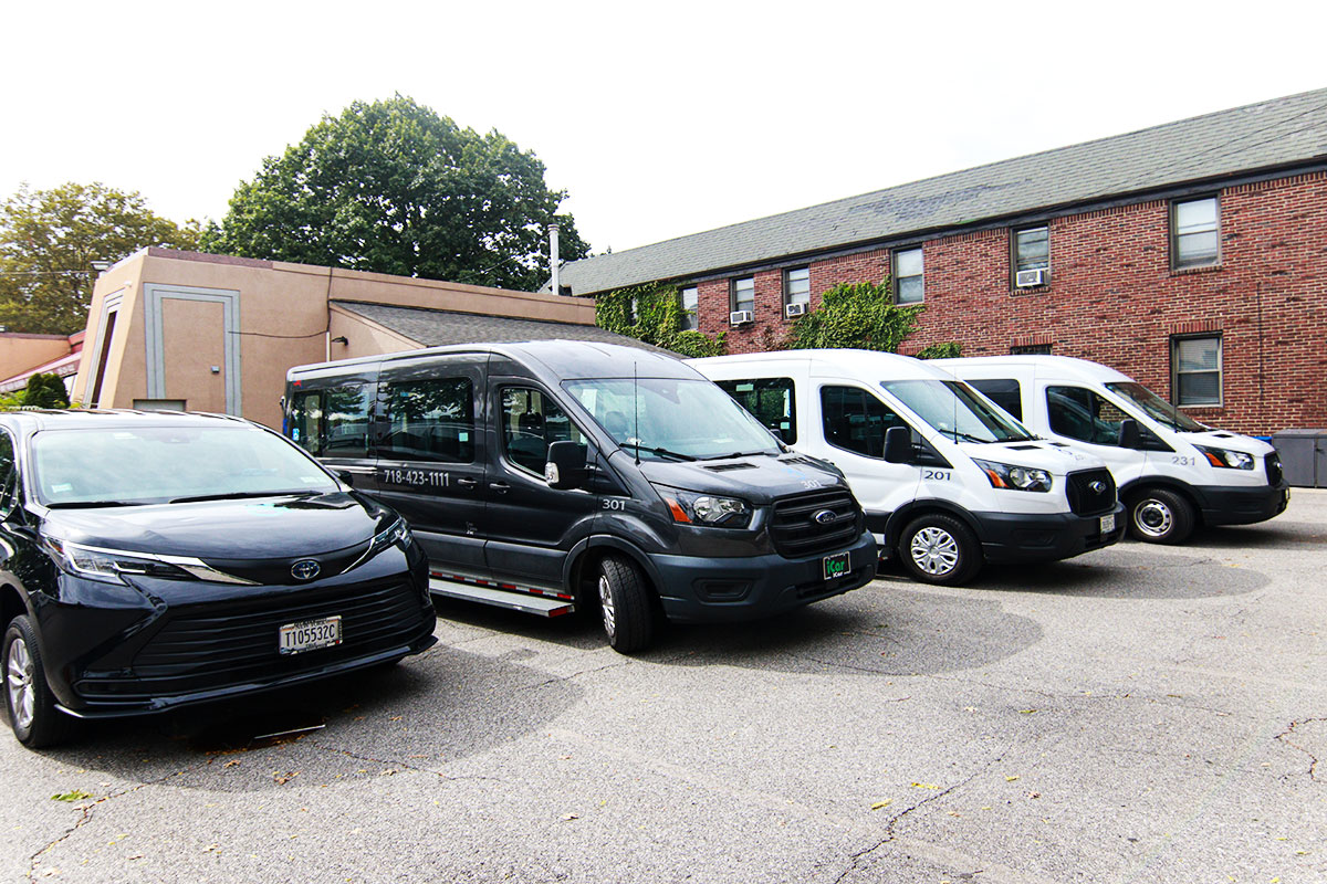 Four ambulettes parked in a line