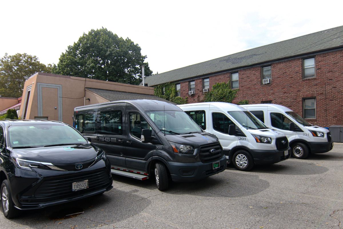 two white and black color cars parked in a row ready for transportation service